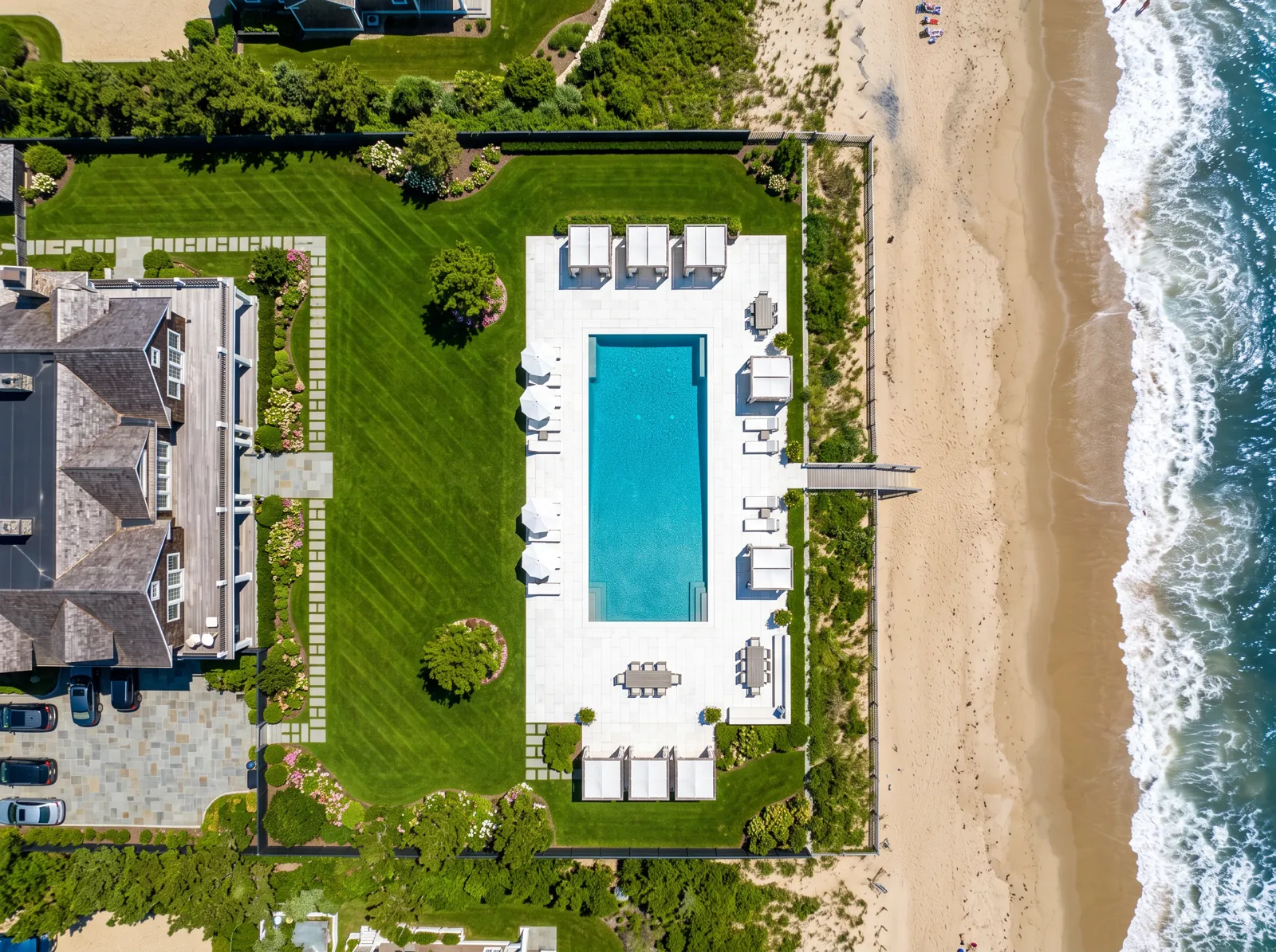 Overhead drone view of a shore estate pool